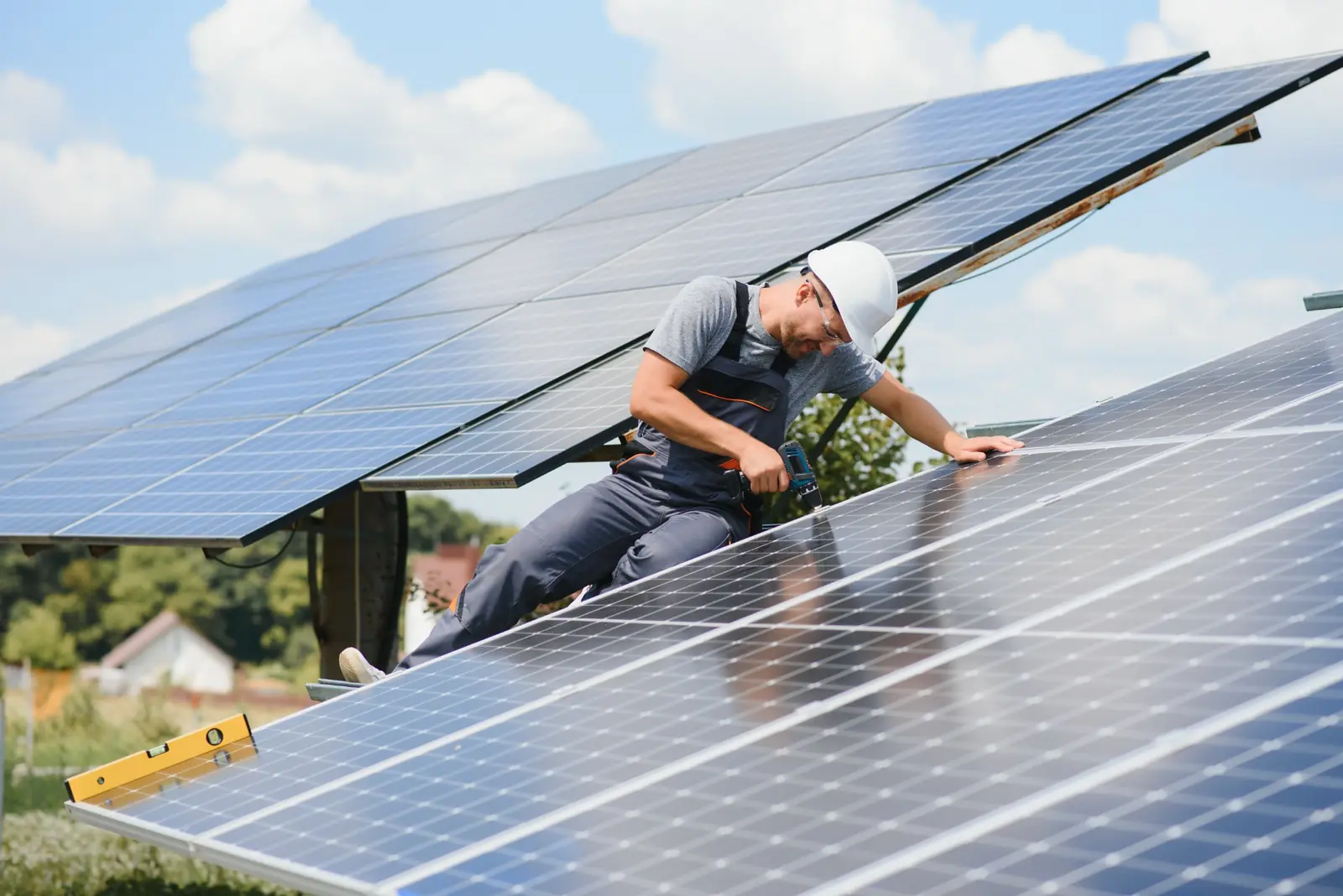 Solar Power Plant Commissioning and Maintenance | P&P Solar Technician inspecting photovoltaic panels during solar power plant commissioning